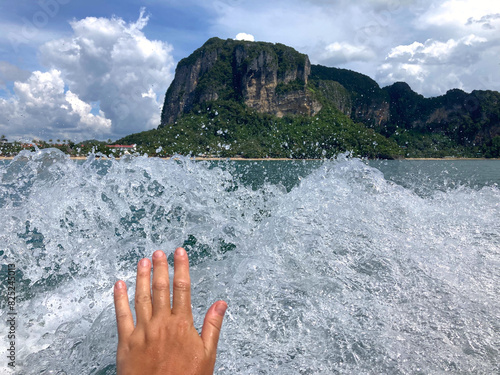 hand touching sea splashes  photo