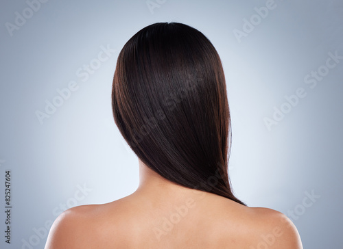 Back, model and hair care in studio with beauty for luxury salon treatment, shampoo and cosmetics. Woman, smile and glow or shine with healthy texture, transformation or growth on white background