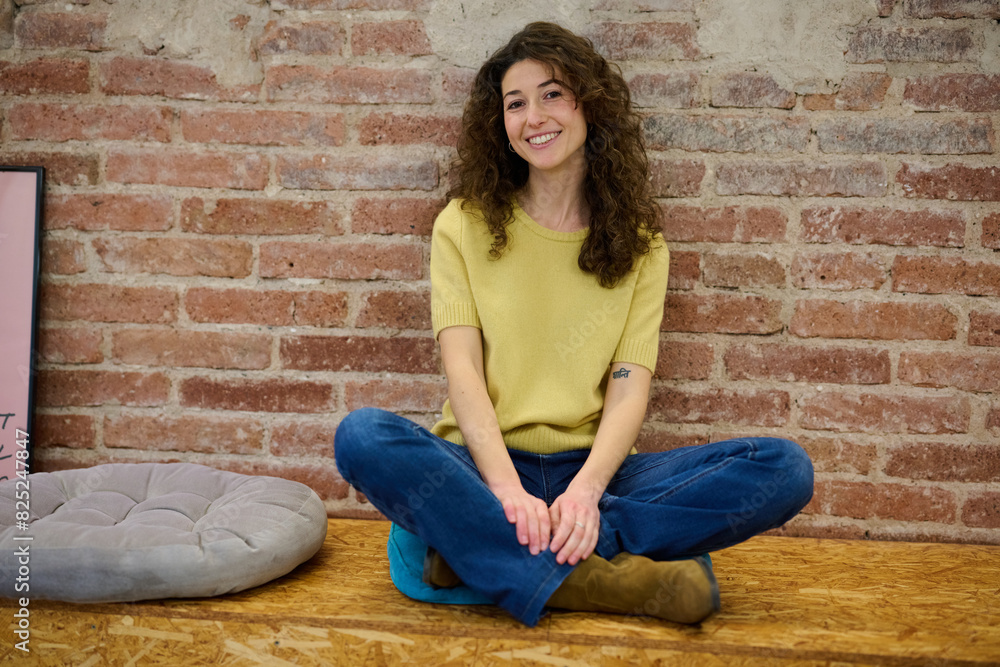Cheerful young woman in yellow sweater and jeans Cheerful young woman in yellow sweater and jeans