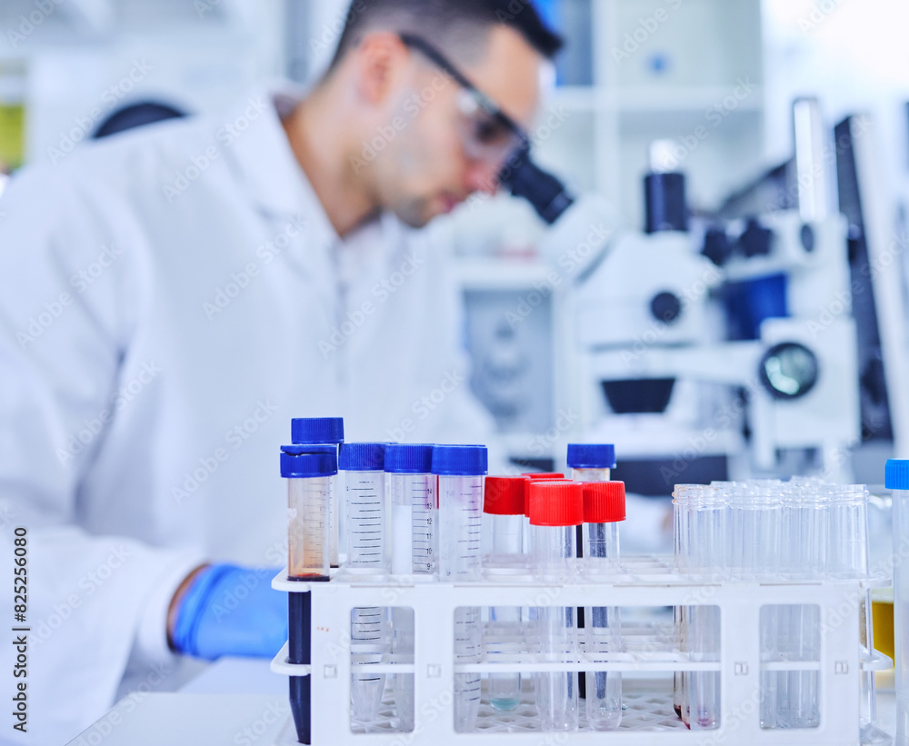 Vials, lab and research in container, test and assessment of results, chemical and liquid for study. Medical, scientist and man with science, ppe and bottle with sample of blood, glasses and safety Vials, lab and research in container, test and assessment of results, chemical and liquid for study. Medical, scientist and man with science, ppe and bottle with sample of blood, glasses and safety