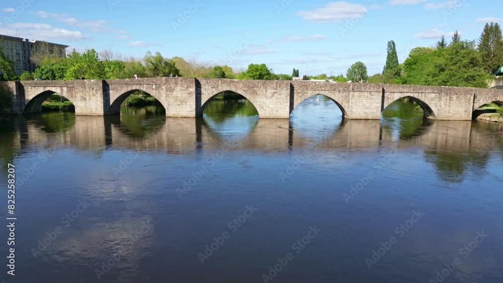 Saint Etienne old bridge on Vienne river, Limoges in France. Aerial drone descending Saint Etienne old bridge on Vienne river, Limoges in France. Aerial drone descending