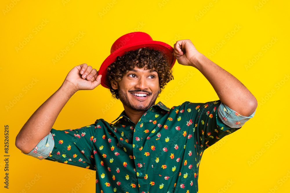 Photo of attractive elegant young man look empty space wear shirt isolated on yellow color background Photo of attractive elegant young man look empty space wear shirt isolated on yellow color background