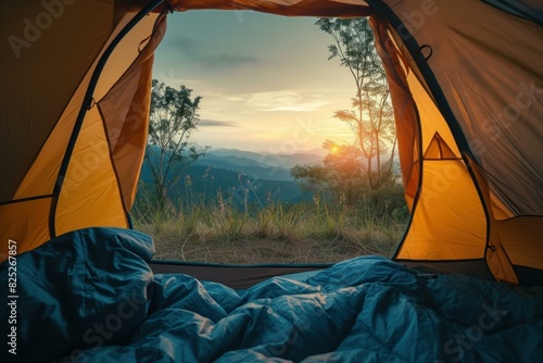 Breathtaking sunrise over mountains seen from the cozy interior of a camper's tent