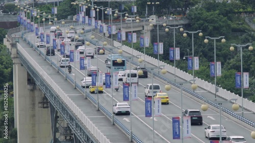 Vehicles driving on the Jialing River Bridge in Chongqing photo