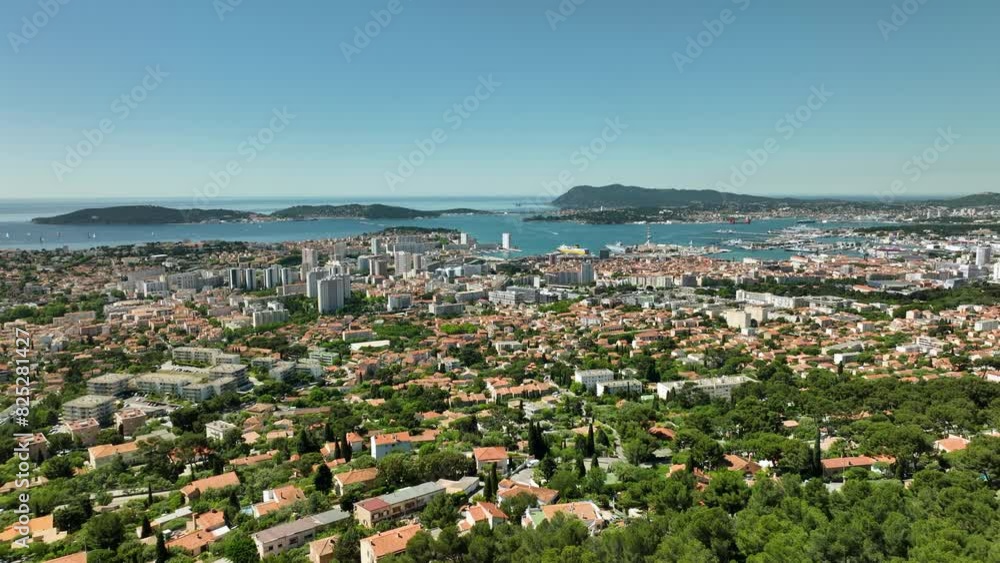 Toulon cityscape with lush greenery, blue sea, and clear sky, aerial view Toulon cityscape with lush greenery, blue sea, and clear sky, aerial view