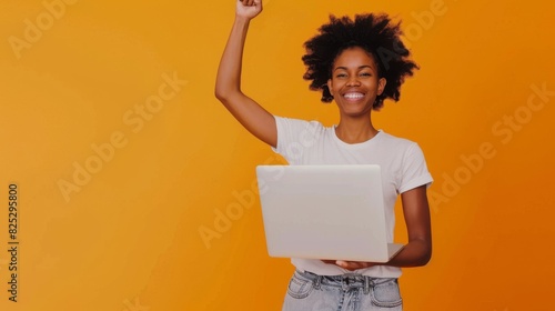 A Woman Celebrating with Laptop photo