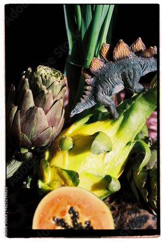 Still life with stegosaurus and pitahaya. photo