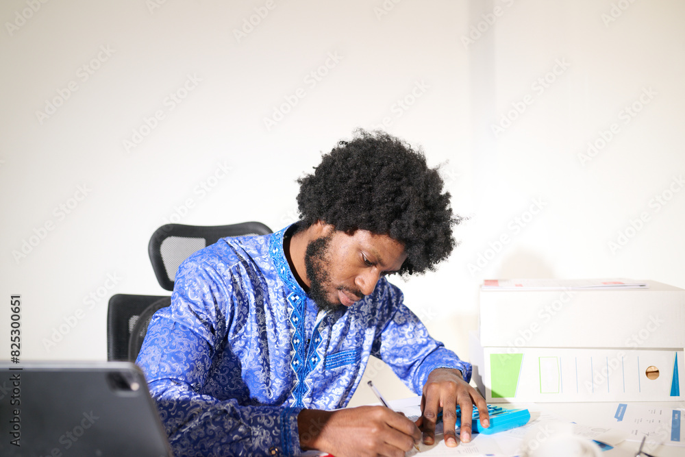working with calculator and documents at office desk. working with calculator and documents at office desk.