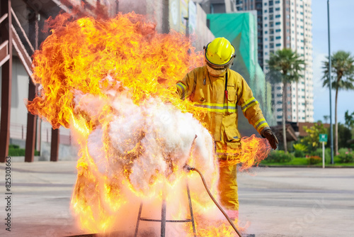 Firefighters teach or demonstrate the fire by pouring water into a very hot oil pan.