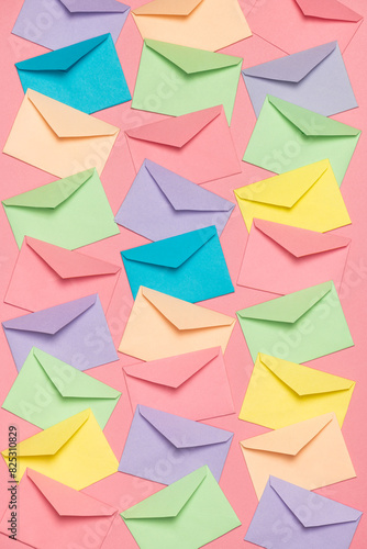Colorful envelopes on pink. Communication, messaging, information. photo