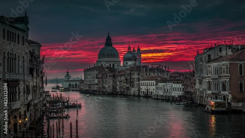 4K Ultra HD Video: Morning View of Colorful Sunrise Clouds over Grand Canal in Venice, Italy, from Accademia Bridge with Basilica di Santa Maria della Salute in Distance photo