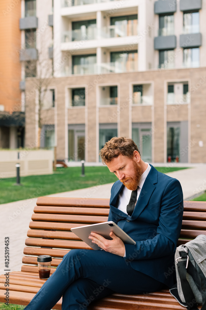 Businessman reading on bench Businessman reading on bench