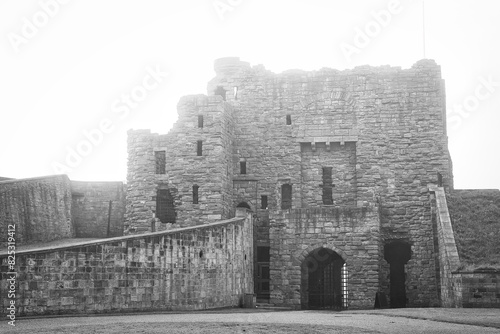 Black and white photo of an old stone castle in Tynemouth Priory and Castle photo