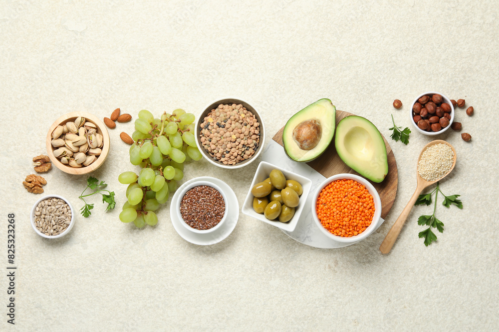 Different products high in natural fats on light table, flat lay Different products high in natural fats on light table, flat lay