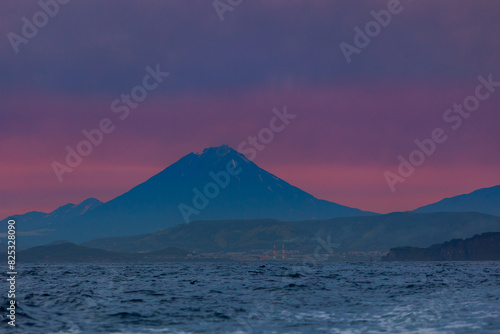 Landscape Petropavlovsk Kamchatsky and Koryaksky Volcano with killer whale. Concept Travel photo Kamchatka Peninsula Russia photo