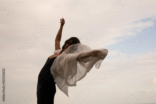 Abstract female dance on beach in sunrise