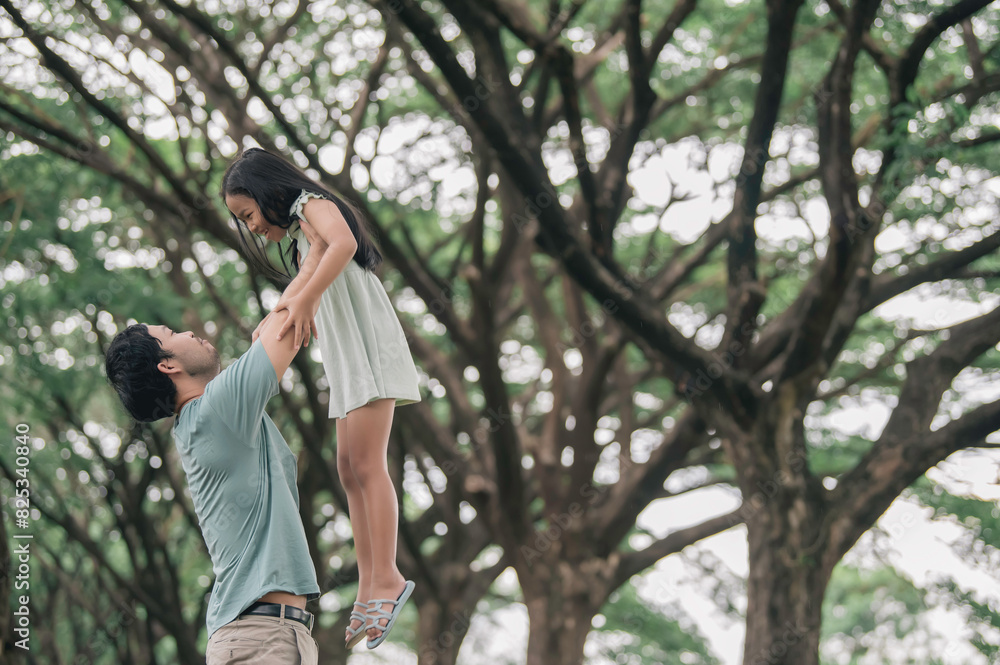 Happy father and daughter hugging while standing at countryside,Father'day concept,enjoying tender moment Happy father and daughter hugging while standing at countryside,Father'day concept,enjoying tender moment