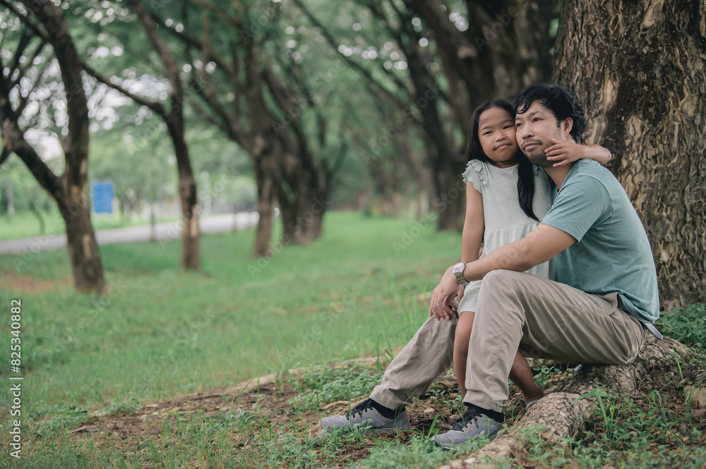 Happy father and daughter hugging while standing at countryside,Father'day concept,enjoying tender moment Happy father and daughter hugging while standing at countryside,Father'day concept,enjoying tender moment