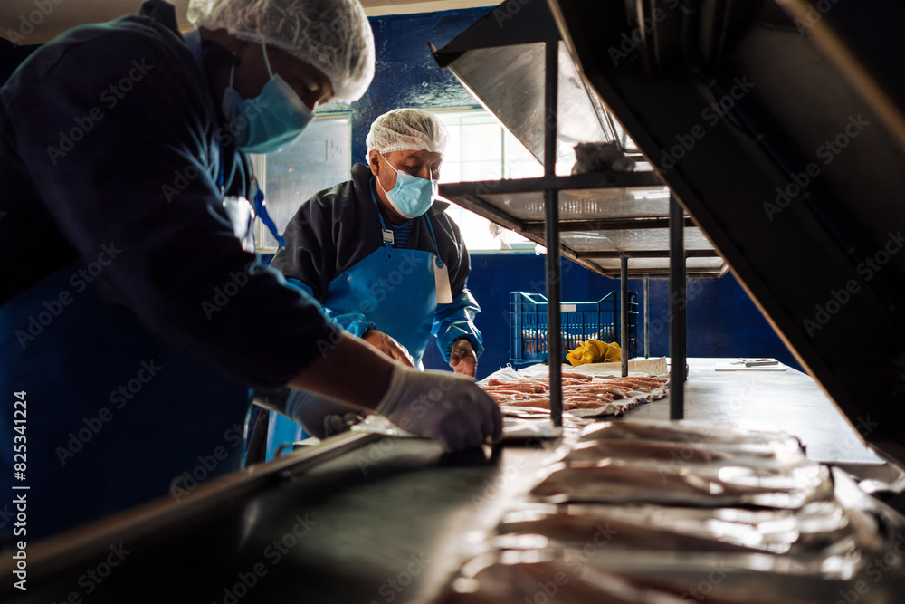 Employees Packing fish fillets Employees Packing fish fillets