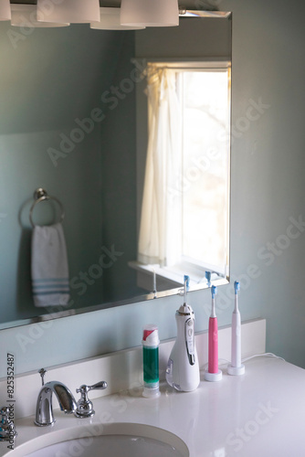 Water flosser and electric toothbrush in bathroom of Home  photo