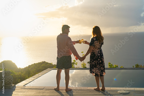 Couple With Cocktails and Ocean View from Caribbean Villa photo