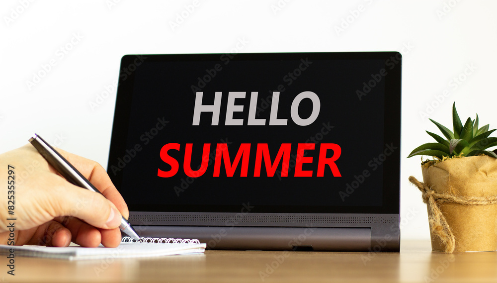 Hello summer symbol. Concept words Hello summer on beautiful black pad. Beautiful white background. Businessman hand. Business lifestyle Hello summer concept. Copy space. Hello summer symbol. Concept words Hello summer on beautiful black pad. Beautiful white background. Businessman hand. Business lifestyle Hello summer concept. Copy space.