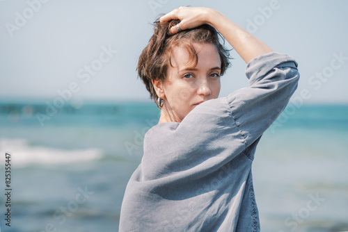 Portrait of a Woman in Wind by the Sea photo