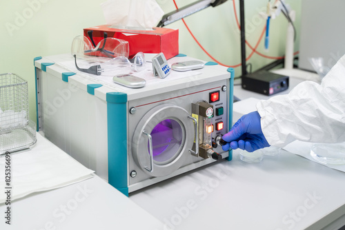 Researcher Using Plasma Surface Treatment Machine photo