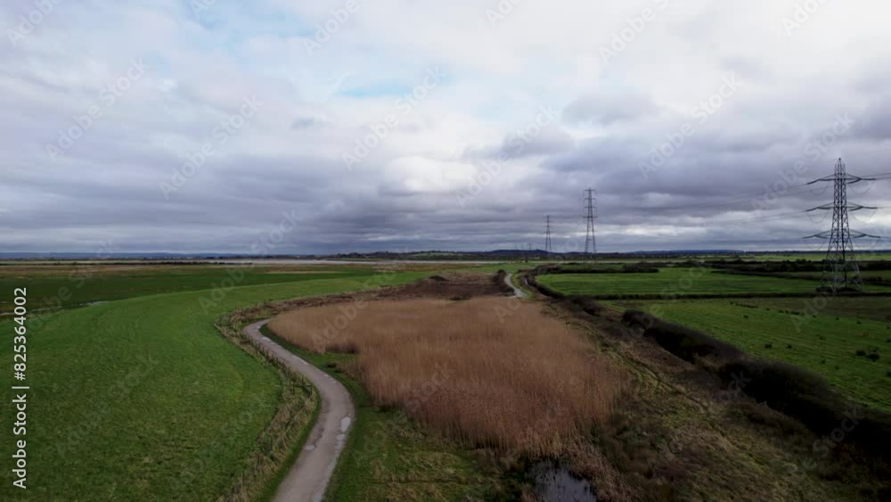 Drone shot of the WWT Steart Marshes nature reserve at sunset in Bridgwater, England, UK Drone shot of the WWT Steart Marshes nature reserve at sunset in Bridgwater, England, UK
