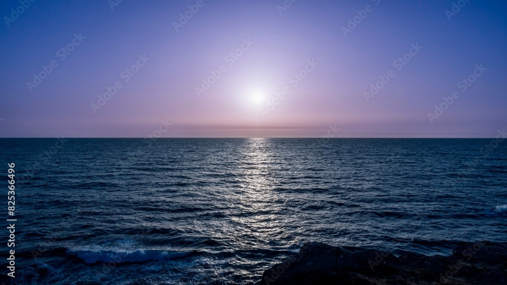 Fototapeta premium Scenic view of sunset over the coastline
