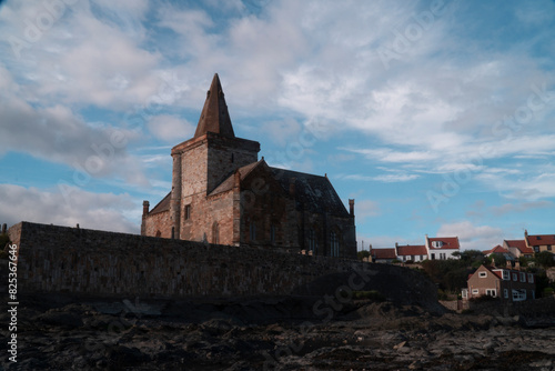 Demolished stone building on bare ground