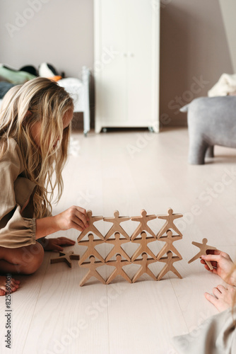 Kids Playing With Wooden Puzzle Indoors photo