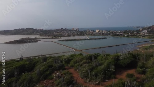 Wallpaper Mural Aerial revealing shot showing salinas of pampatar in Venezuela during sunny day. Salt lake beds with city in background. Wide shot. Torontodigital.ca