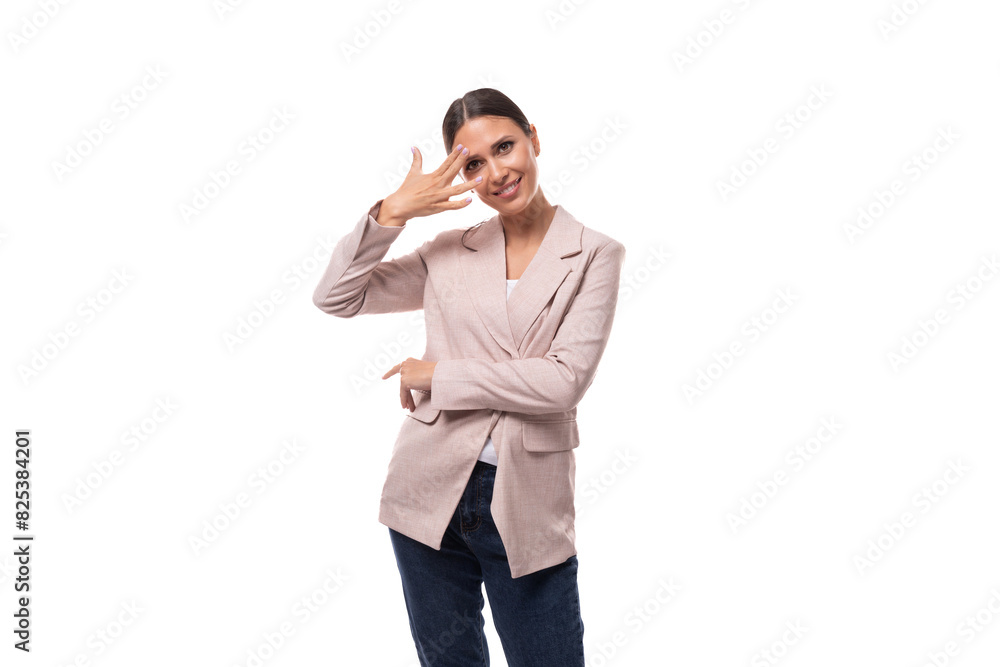 young attractive european brunette woman dressed in a stylish beige jacket on a white background with copy space young attractive european brunette woman dressed in a stylish beige jacket on a white background with copy space