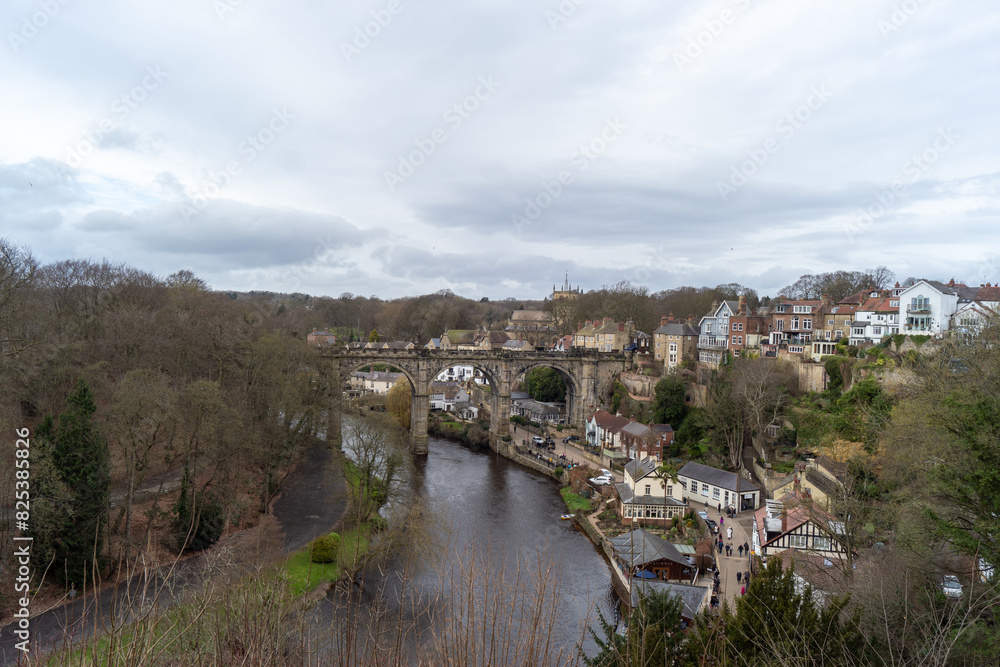 River running alongside urban cityscape