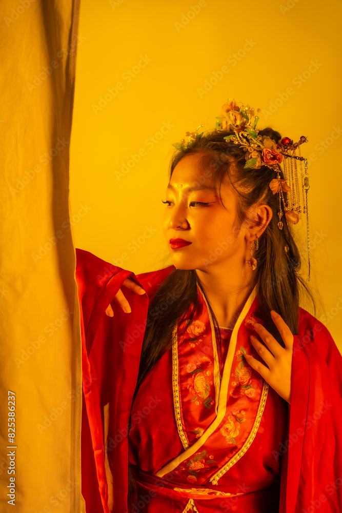 A woman in a red dress with a flower headpiece A woman in a red dress with a flower headpiece
