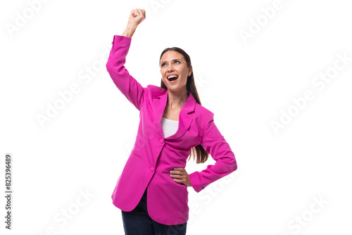 a young slender office worker woman with black hair dressed in a crimson jacket is dancing