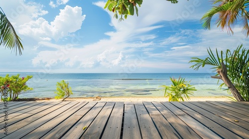Wooden deck with a beautiful sea and sky background, overlooking the beach and ocean. This tropical wooden deck is situated at the seafront by the beach. photo