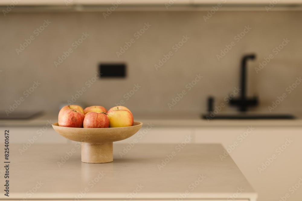 Basket with fresh fruits on table in kitchen Basket with fresh fruits on table in kitchen