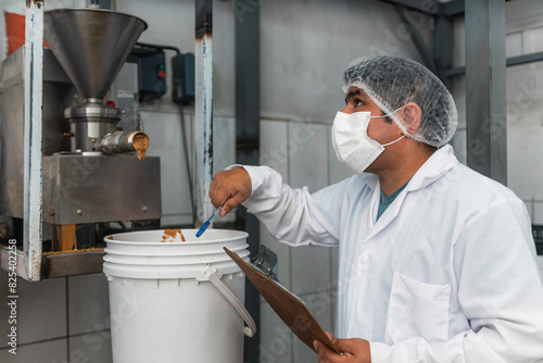 Food Industry Worker Supervising Process photo
