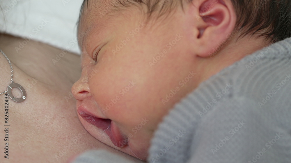 Infant's First Days - Sleeping Peacefully on Mother's Chest During Early Life, newborn baby close-up face with cute expression Infant's First Days - Sleeping Peacefully on Mother's Chest During Early Life, newborn baby close-up face with cute expression