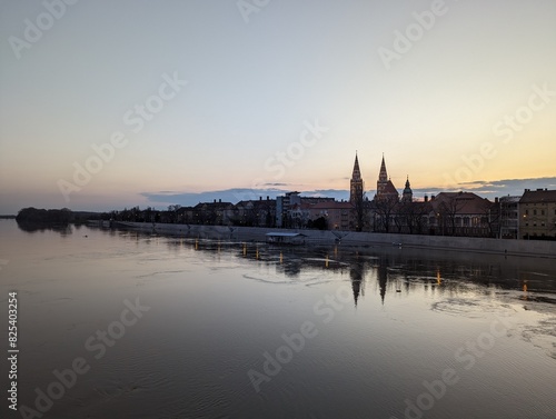 View of Szeged at dusk  seen over an overflown Tisza river