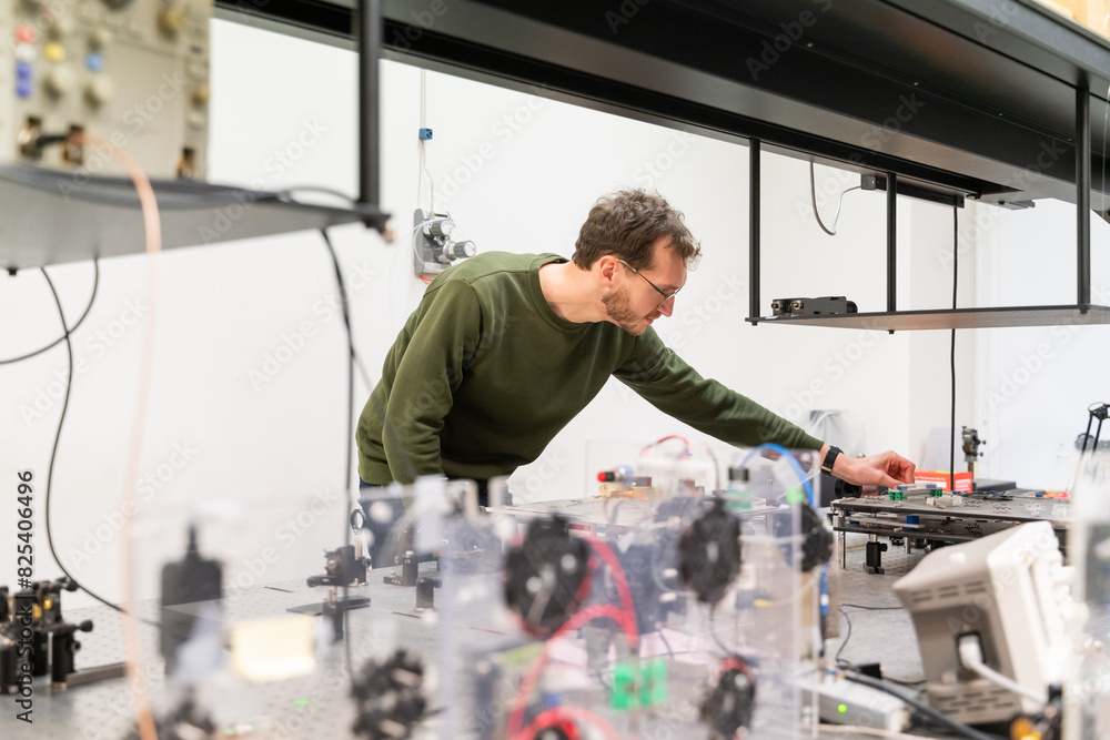 Scientist Working With Fiber Laser Experiment Scientist Working With Fiber Laser Experiment
