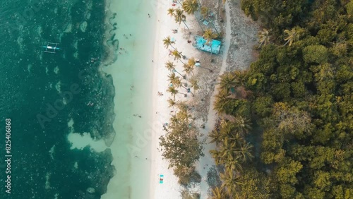 Bird's eye drone shot of Salagdoong Tropical Beach on a sunny day in Maria, Siquijor, Philippines photo