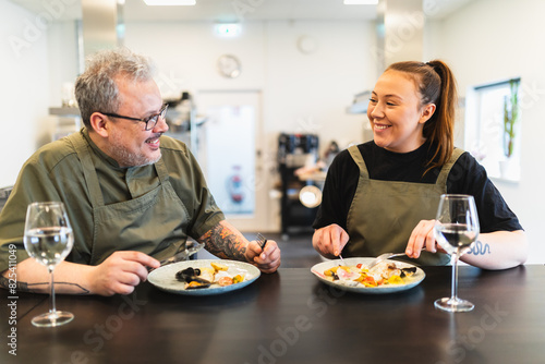 Two chef doing a food tasting photo