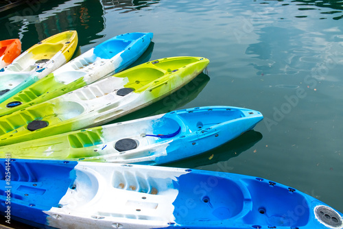 Kayaks moored for rent on Lake Cheo Lan in Thailand. Kayaking on the lake. Tourist entertainment.