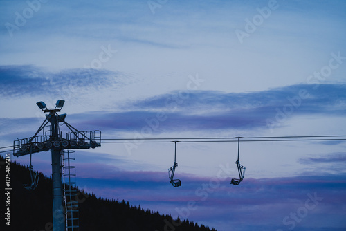 Ski lift with evening sky.