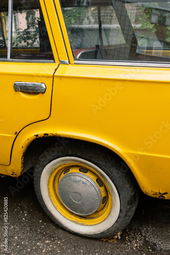 Flat Tire on a Yellow Vehicle photo