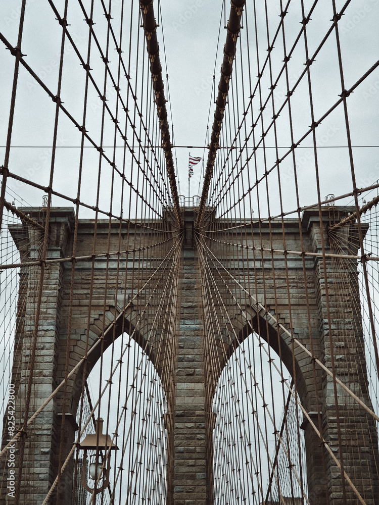 Fototapeta premium the cables on the brooklyn bridge that will be closed in half