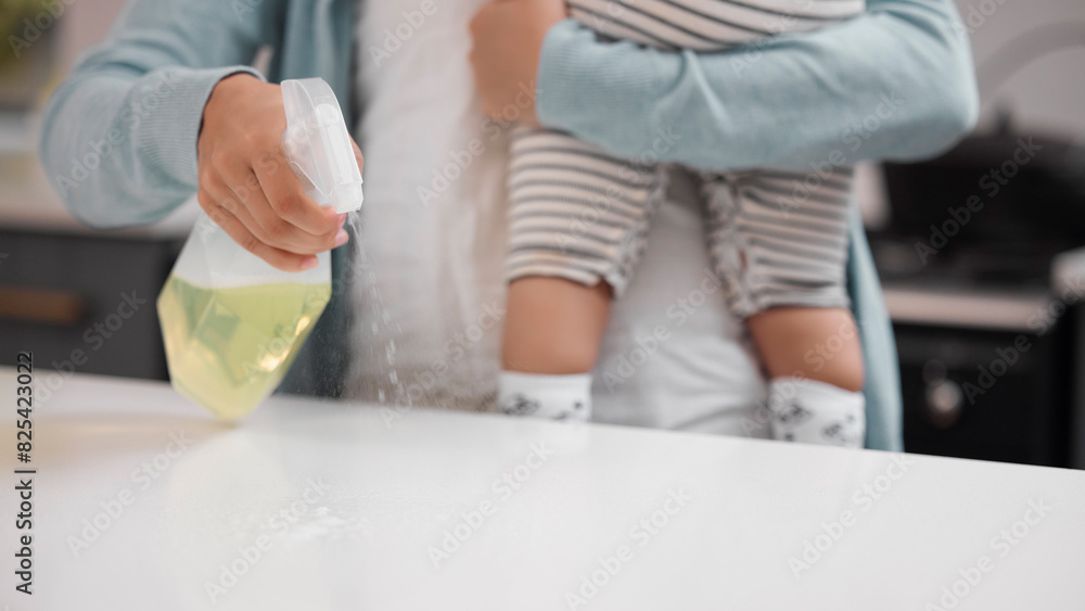 Table, cleaning and hand of person with spray for housekeeping, hygiene or maintenance on weekend. Kitchen, baby and housewife with chemical at home for safety, surface or removal of bacteria Table, cleaning and hand of person with spray for housekeeping, hygiene or maintenance on weekend. Kitchen, baby and housewife with chemical at home for safety, surface or removal of bacteria